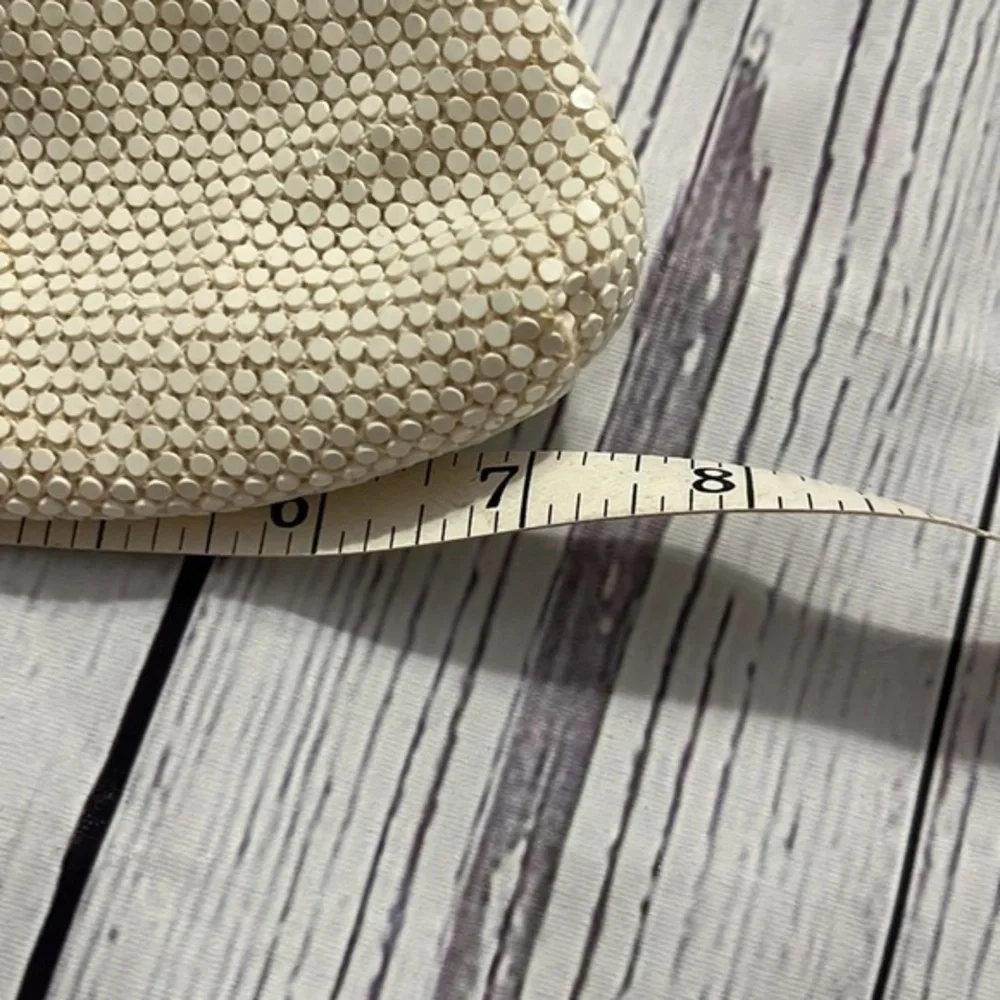 Dainty special occasion clutch with snap hinge closure cream